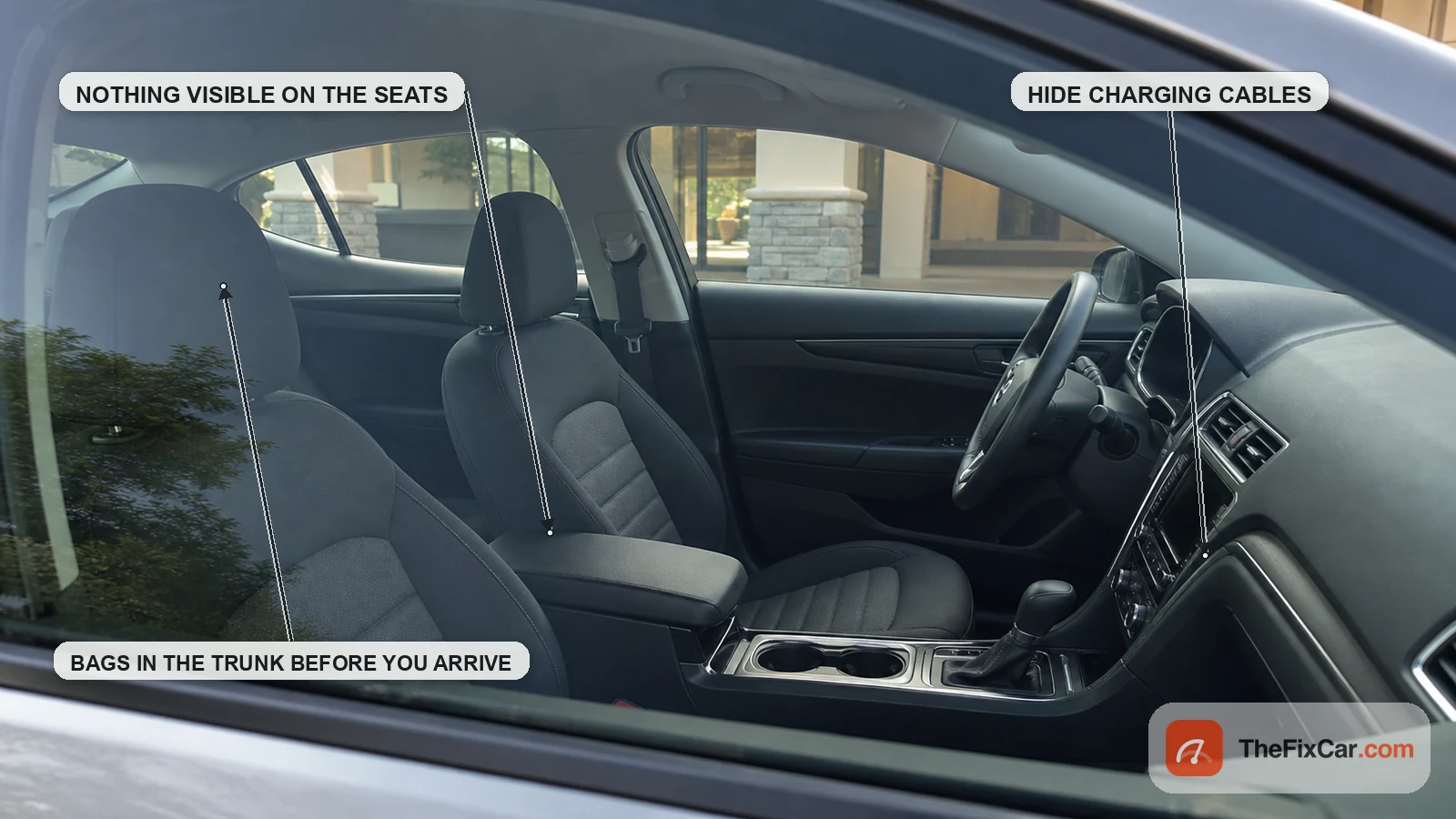 Tidy car interior seen through the window with callouts to keep valuables out of sight