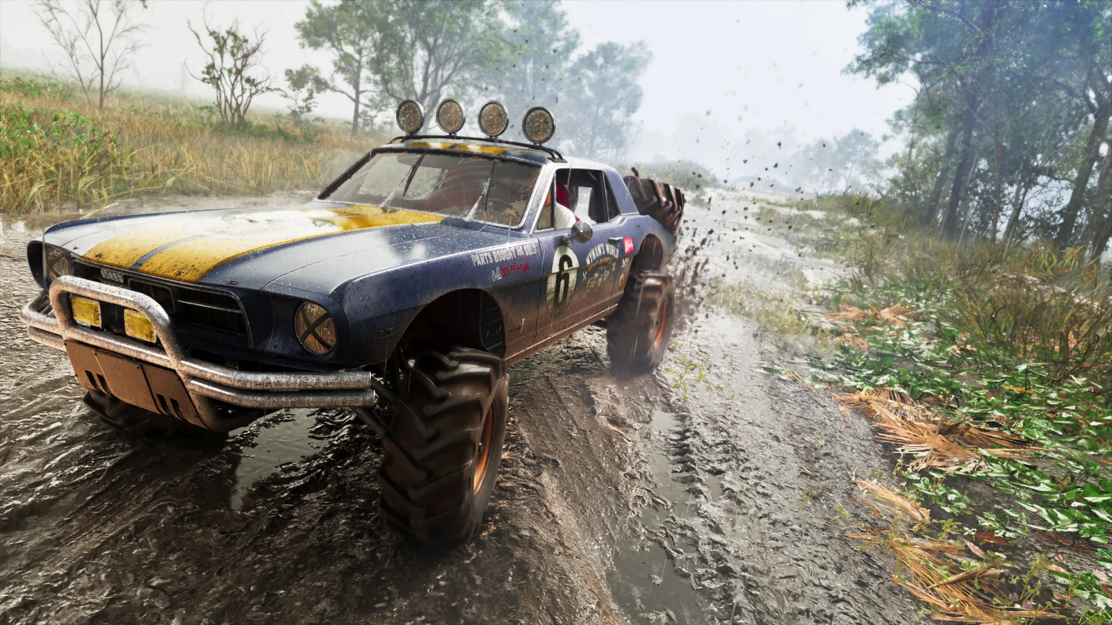 The Dominator Buggy throwing up spray while driving through water