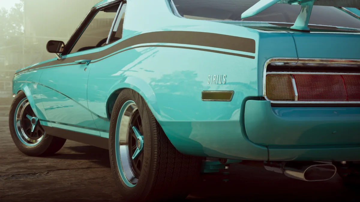 Rear three-quarter view of a teal muscle car in the Wyman collection