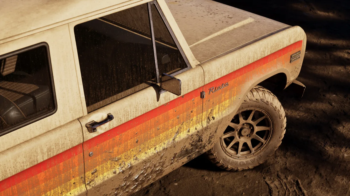 A weathered white and orange pickup truck in the Wyman collection