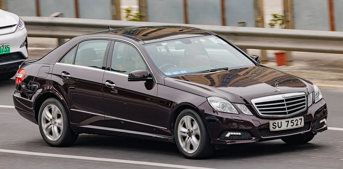 A dark Mercedes-Benz E-Class W212 saloon