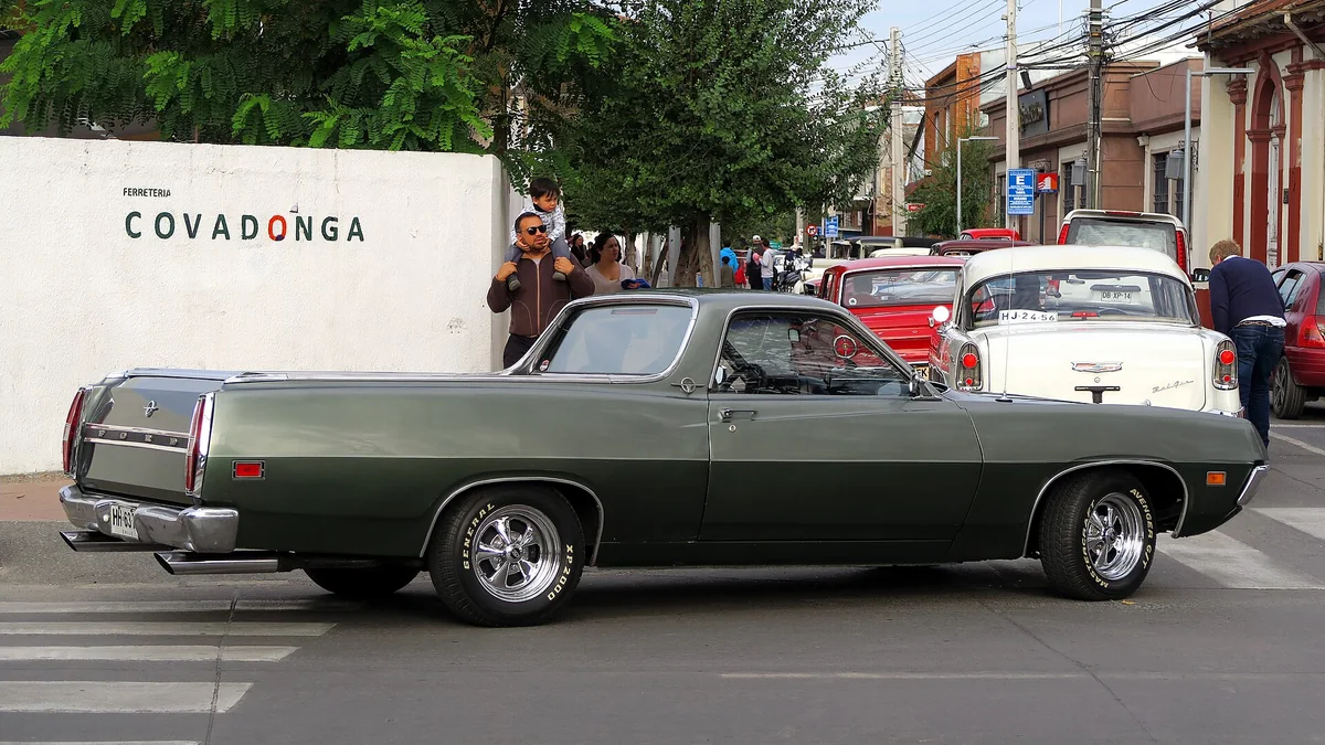 A dark green 1970 Ford Ranchero coupe utility