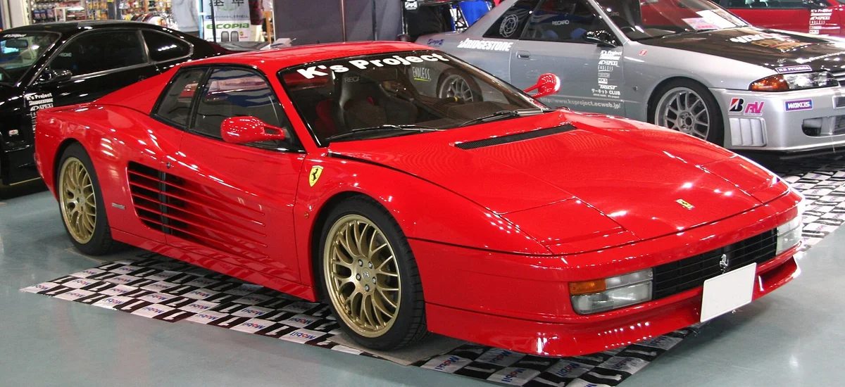 A red Ferrari Testarossa with side strakes